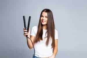 CAN I USE A FLAT OR CURLING IRON ON MY HAIR EXTENSIONS?